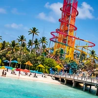 Perfect Day at CocoCay: a tall waterslide tower over a beach and turquoise water